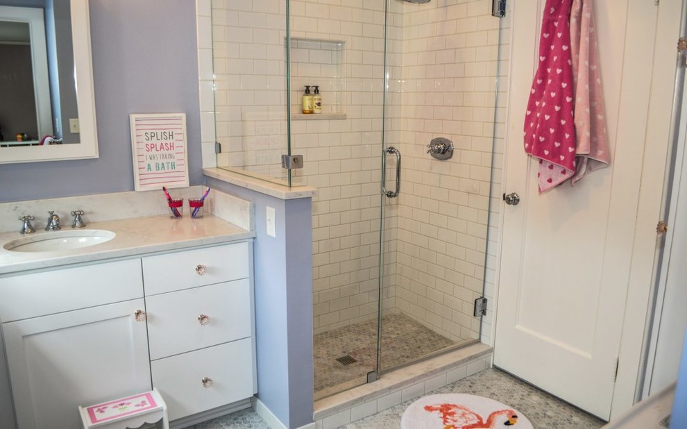 Design ideas for a small traditional kids bathroom in Cleveland with furniture-like cabinets, white cabinets, a corner shower, a two-piece toilet, white tile, subway tile, blue walls, marble floors, an undermount sink, engineered quartz benchtops, grey floor, a hinged shower door and white benchtops.