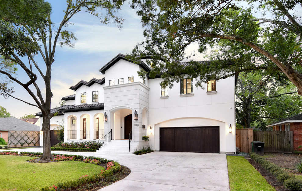 Inspiration for a traditional two-storey white exterior in Houston with a hip roof.