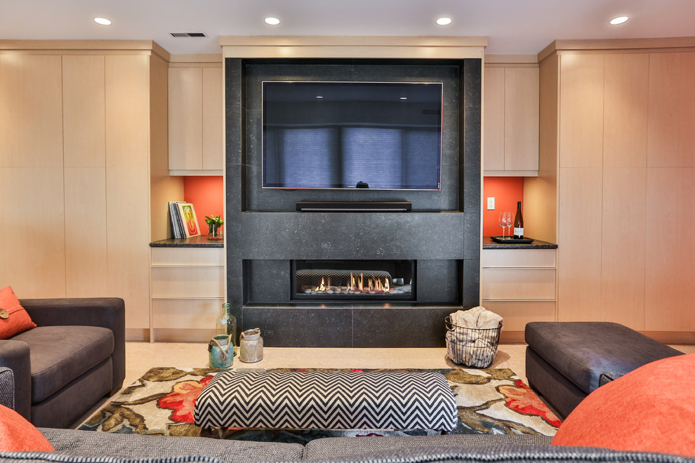 This is an example of a mid-sized contemporary basement in Vancouver with red walls, a ribbon fireplace and a stone fireplace surround.