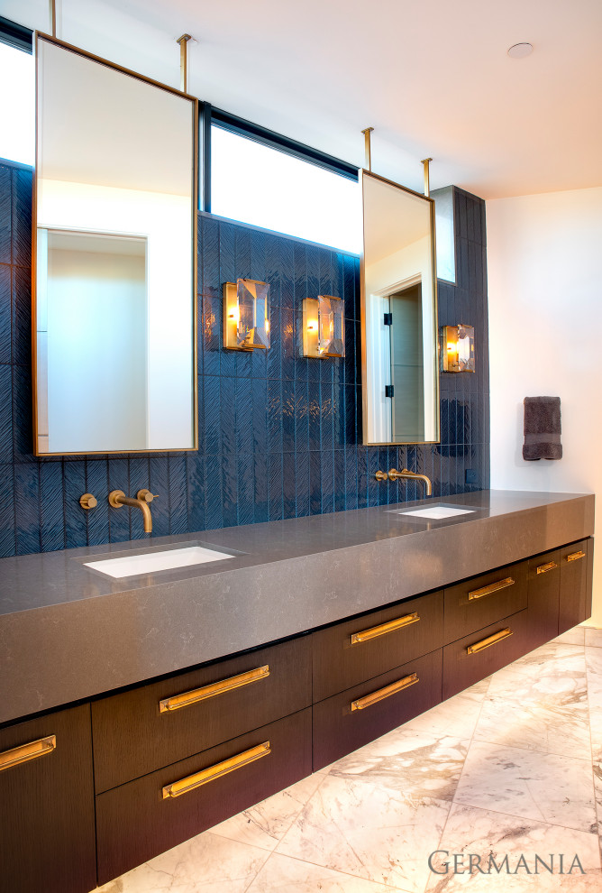 Transitional bathroom in Salt Lake City with flat-panel cabinets, dark wood cabinets, blue tile, white walls, a wall-mount sink, beige floor, grey benchtops, a double vanity and a floating vanity.