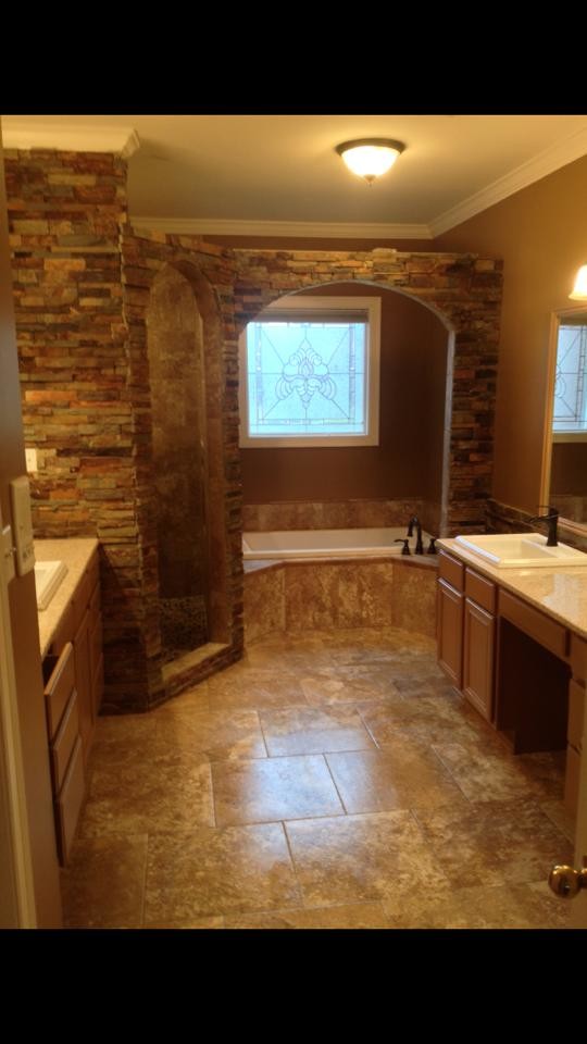Mid-sized mountain style master drop-in bathtub photo with a vessel sink and granite countertops