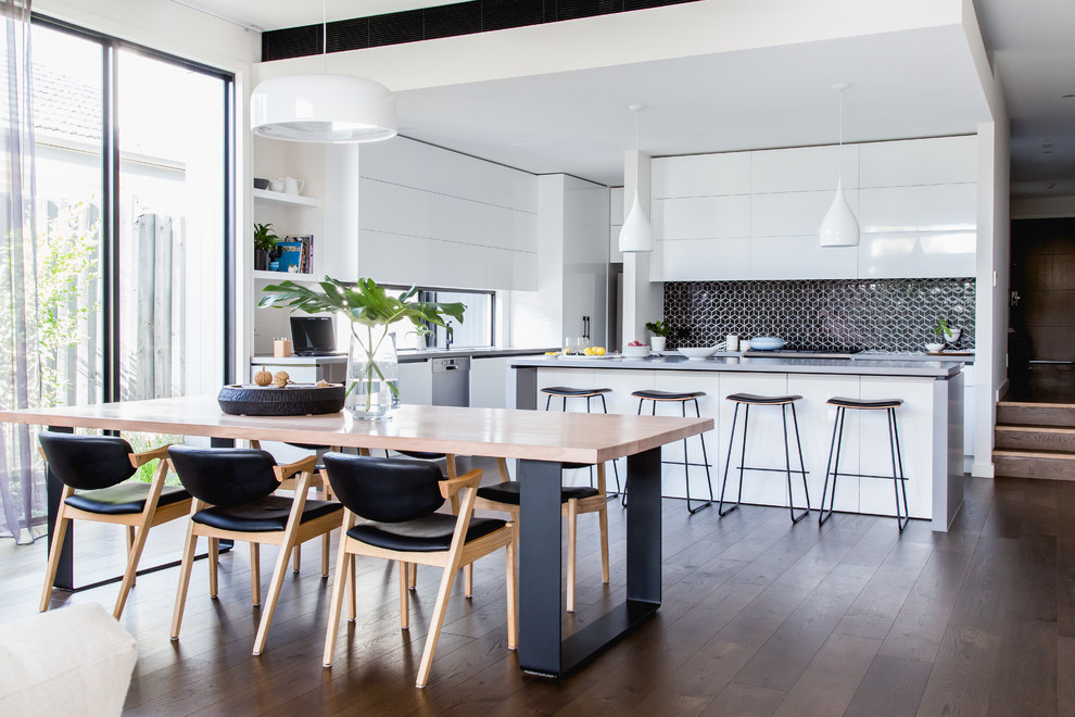 Photo of a mid-sized contemporary open plan dining in Melbourne with white walls, dark hardwood floors, no fireplace and brown floor.