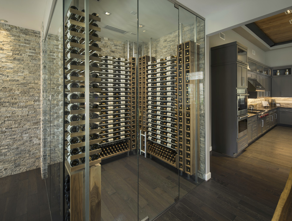 Design ideas for a mid-sized modern wine cellar in Phoenix with medium hardwood floors, storage racks and brown floor.