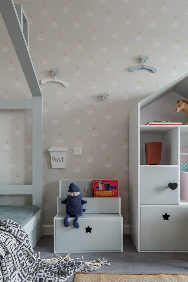 Design ideas for a mid-sized contemporary kids' playroom for kids 4-10 years old and girls in Moscow with grey walls, medium hardwood floors and grey floor.