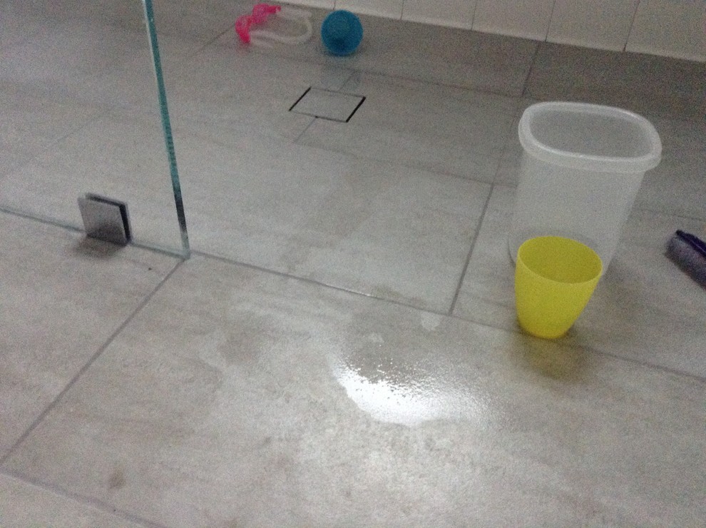 Ugh, new tile shower not drainingpuddles