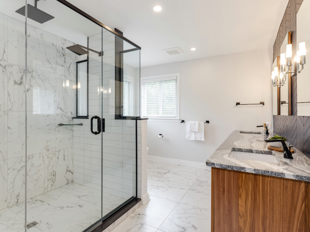 Inspiration for a contemporary bathroom in Ottawa with flat-panel cabinets, dark wood cabinets, a corner shower, white tile, porcelain floors, an undermount sink, engineered quartz benchtops, white floor, a hinged shower door, grey benchtops, a double vanity and a built-in vanity.