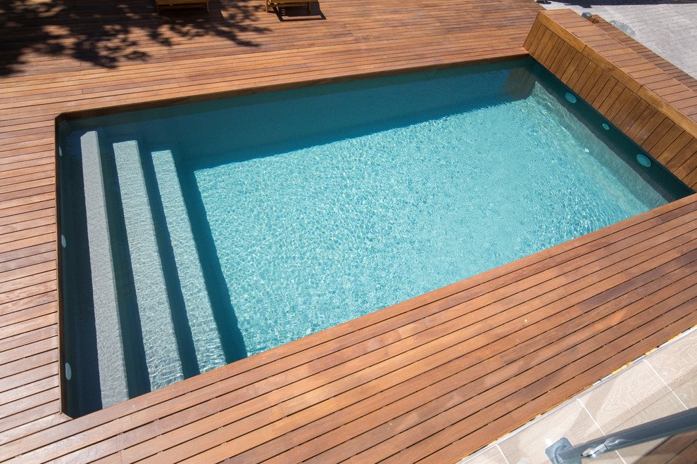 Foto de piscina infinita minimalista grande rectangular