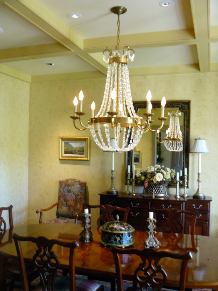 Enclosed dining room - mid-sized transitional enclosed dining room idea in Providence with yellow walls