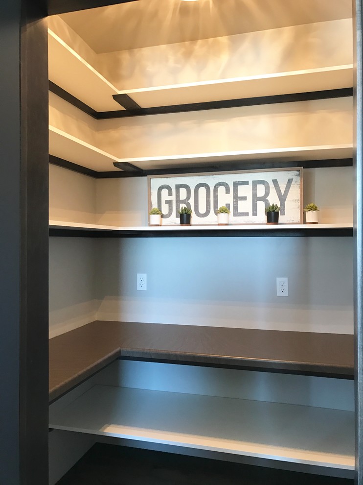 Example of a mid-sized country l-shaped medium tone wood floor and beige floor eat-in kitchen design with an undermount sink, flat-panel cabinets, white cabinets, quartzite countertops, multicolored backsplash, ceramic backsplash, stainless steel appliances and an island
