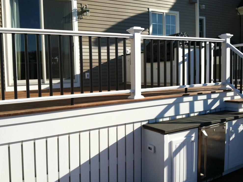 Outdoor kitchen deck - large contemporary backyard outdoor kitchen deck idea in Providence with no cover