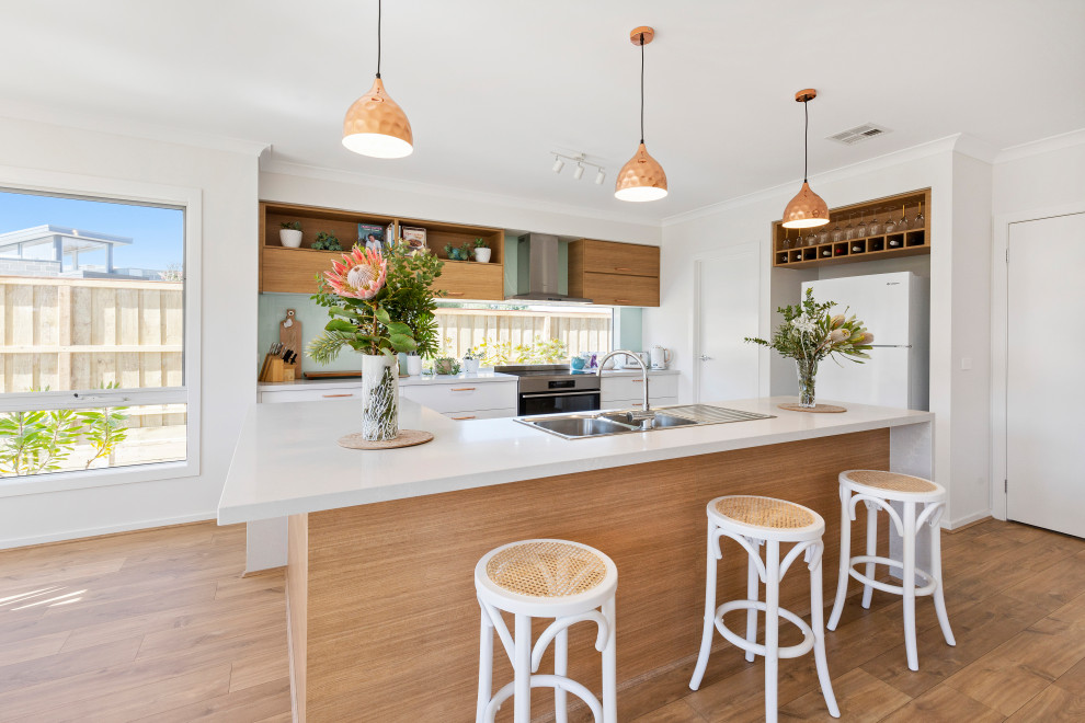 This is an example of a beach style kitchen in Melbourne.