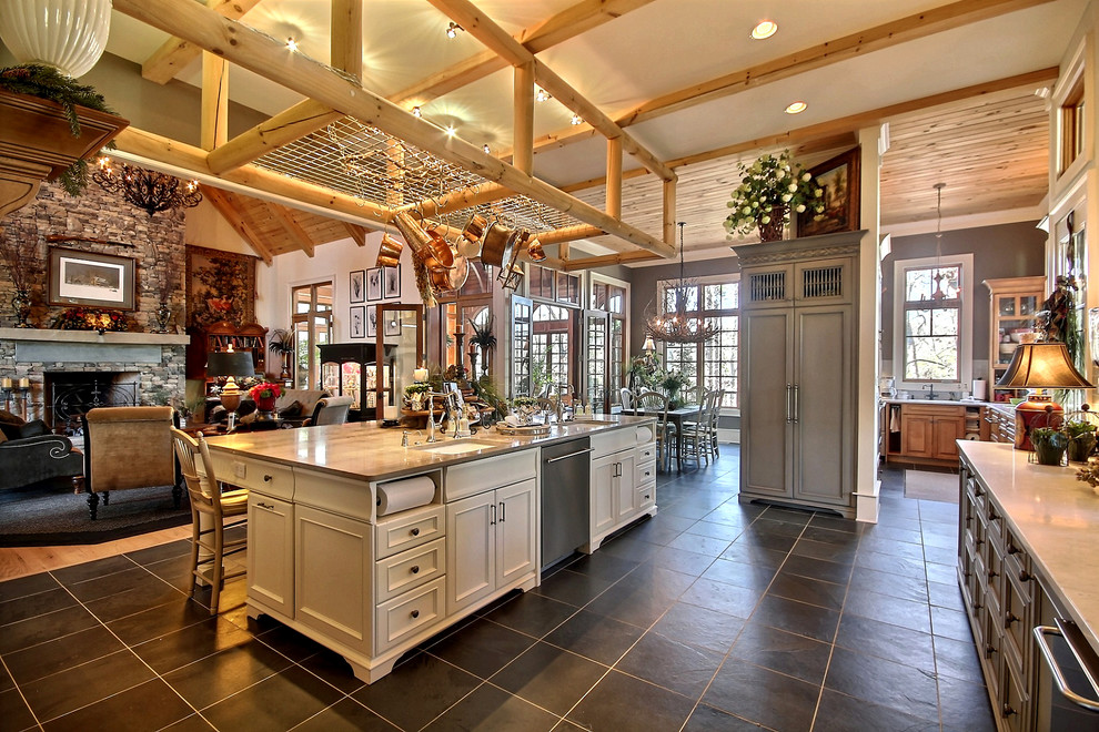 Expansive country l-shaped eat-in kitchen in Atlanta with a drop-in sink, raised-panel cabinets, white cabinets, grey splashback, with island, stainless steel appliances, ceramic floors and grey floor.