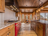 Rustic Kitchen by Woodland Designs, Inc.