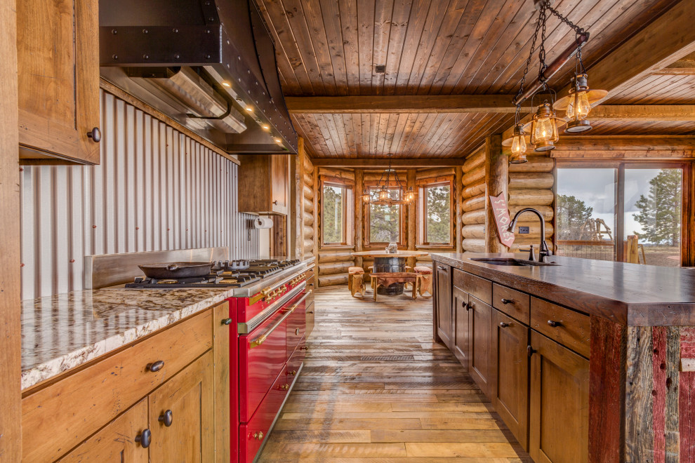 Inspiration for a country galley open plan kitchen in Denver with an undermount sink, shaker cabinets, medium wood cabinets, wood benchtops, grey splashback, metal splashback, coloured appliances, medium hardwood floors, with island, brown floor, brown benchtop and wood.