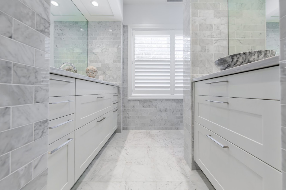 Photo of an expansive modern bathroom in New York with shaker cabinets and white cabinets.