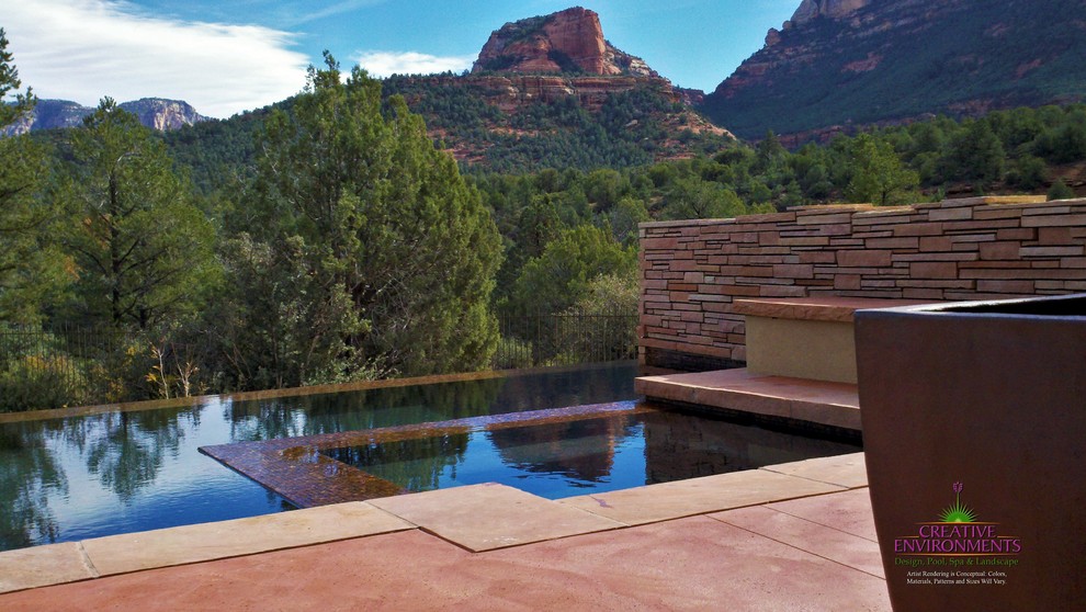 Example of a large backyard stamped concrete and custom-shaped hot tub design in Phoenix