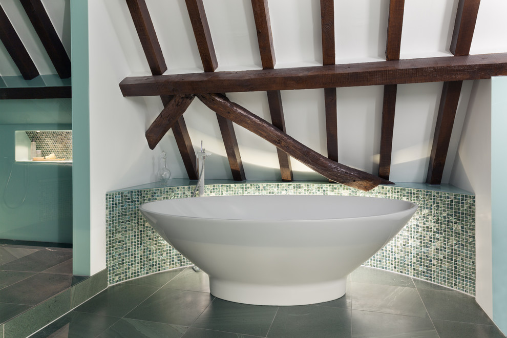 This is an example of a contemporary bathroom in Other with a freestanding tub.