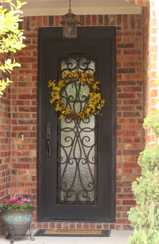 Inspiration for a traditional front door in Dallas with a single front door and a metal front door.