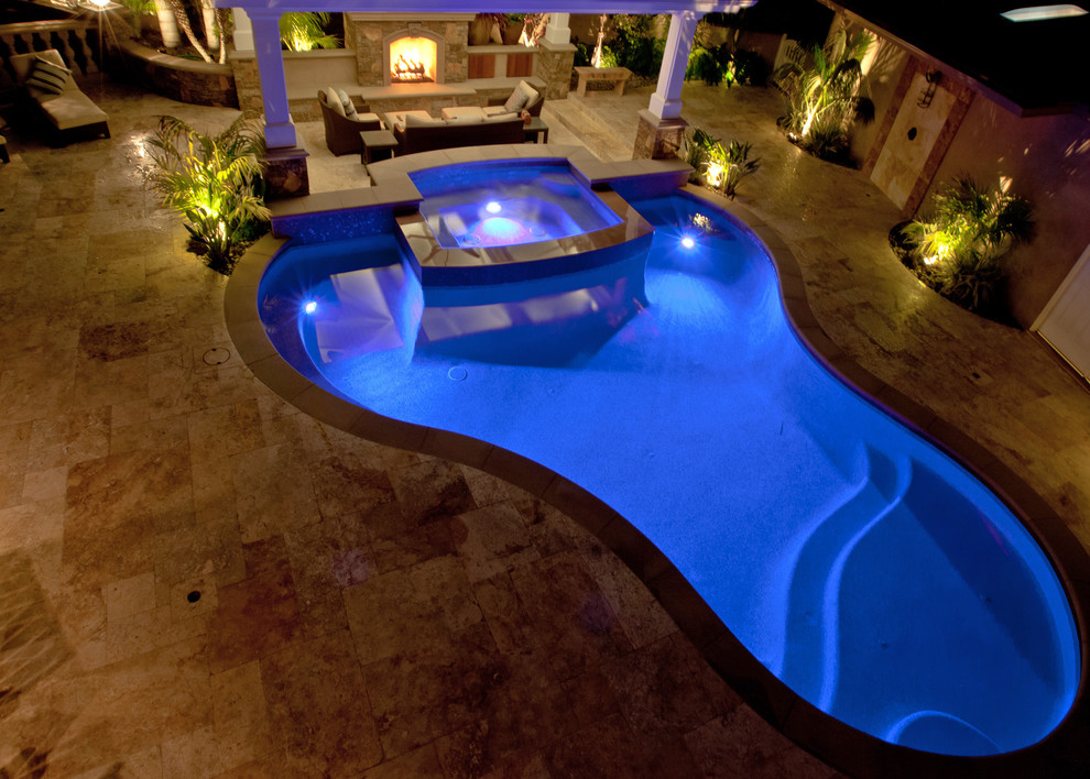 Large contemporary backyard custom-shaped pool in Orange County.