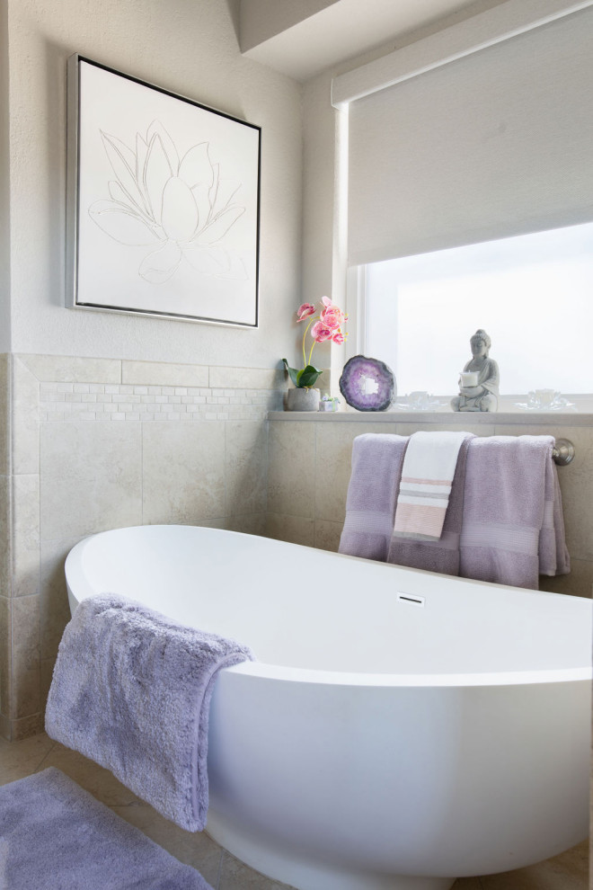 Barker Ridge Drive - Eclectic master double-sink freestanding bathtub photo in Austin with white cabinets, an undermount sink, quartzite countertops and a built-in vanity