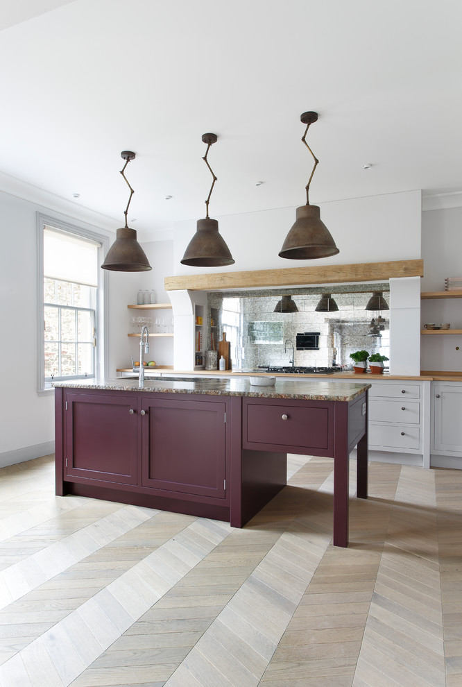 Photo of a mid-sized traditional open plan kitchen in Other with a double-bowl sink, shaker cabinets, purple cabinets, granite benchtops, metallic splashback, glass tile splashback, stainless steel appliances, light hardwood floors, with island, grey floor and green benchtop.