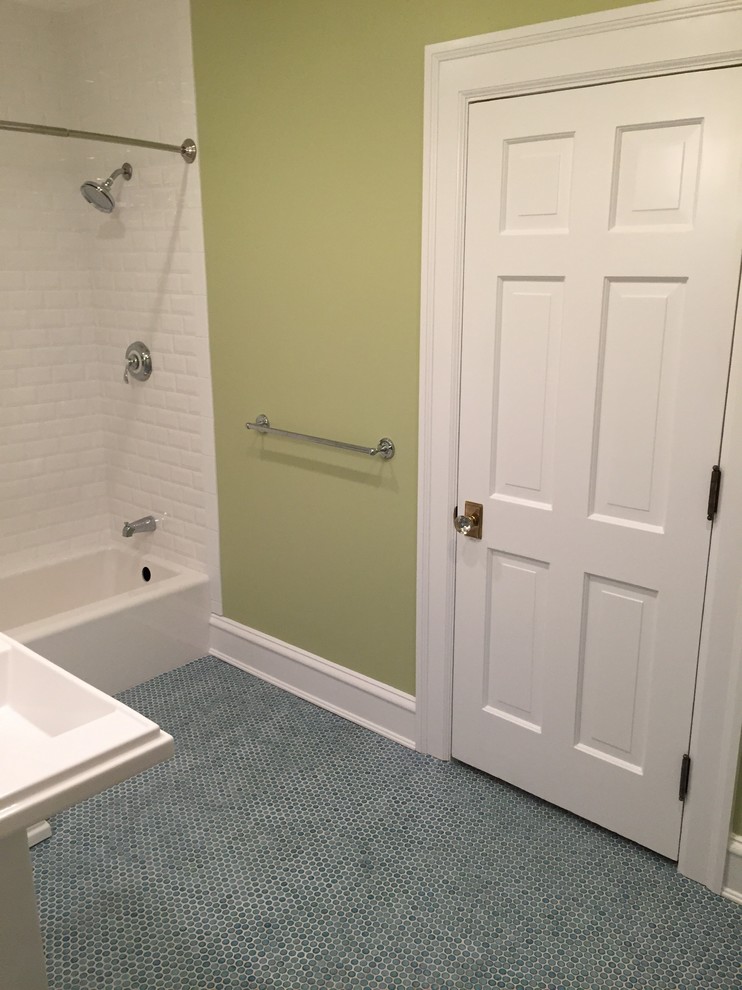 Transitional kids bathroom in Cleveland with an alcove tub, a shower/bathtub combo, a two-piece toilet, white tile, subway tile, green walls, mosaic tile floors and a pedestal sink.