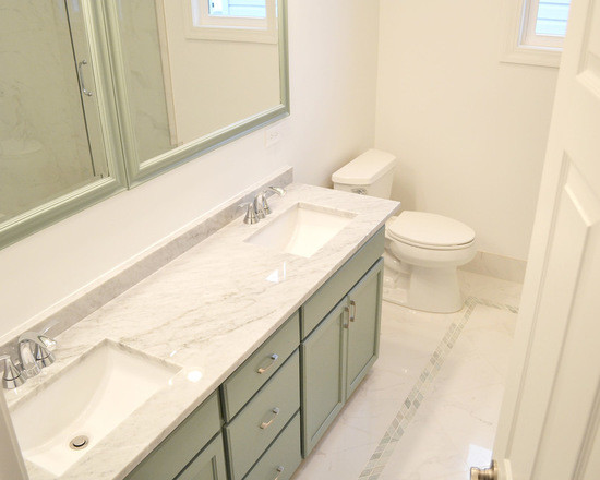 This is an example of a mid-sized traditional master bathroom in Chicago with shaker cabinets, green cabinets, an alcove shower, a two-piece toilet, multi-coloured tile, mosaic tile, white walls, marble floors, an undermount sink and marble benchtops.