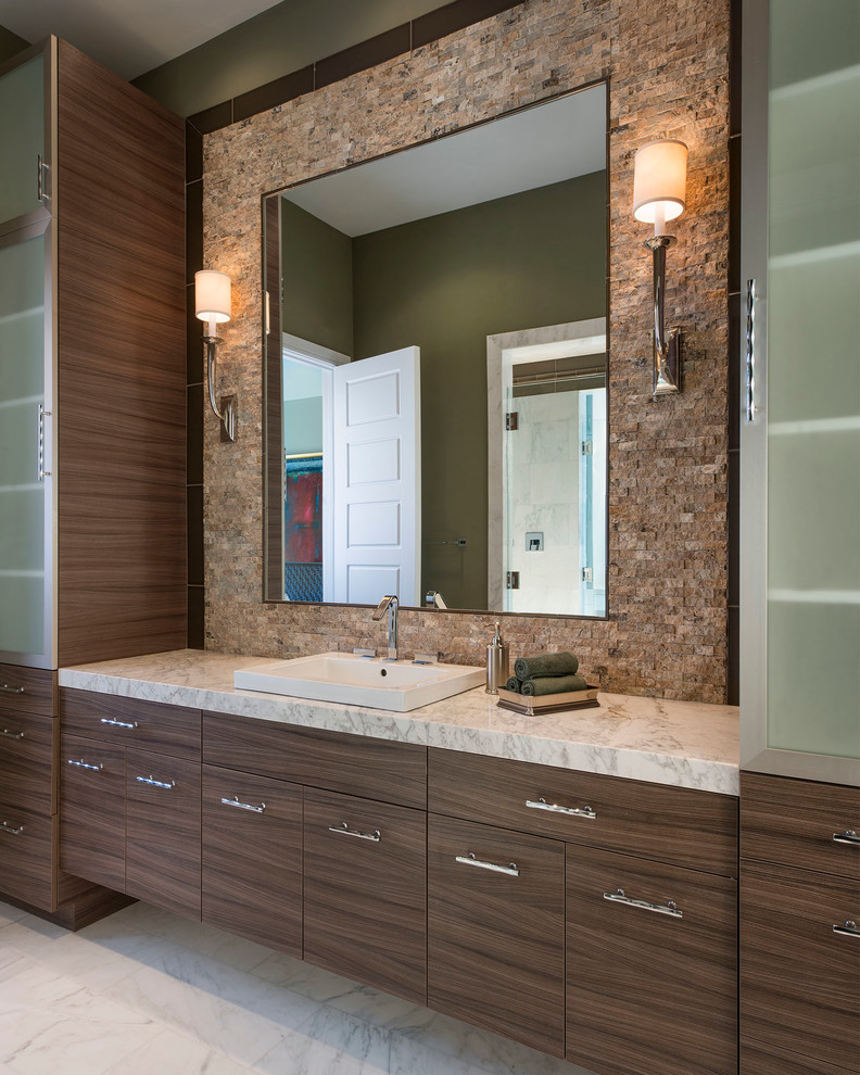 Photo of a large contemporary master bathroom in Dallas with a drop-in sink, flat-panel cabinets, dark wood cabinets, marble benchtops, a drop-in tub, a double shower, a two-piece toilet, white tile, stone slab, green walls and marble floors.