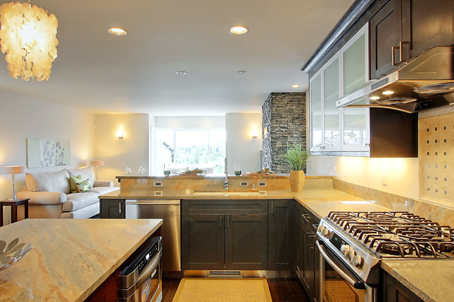 Example of a transitional eat-in kitchen design in Seattle with an undermount sink, granite countertops and stainless steel appliances