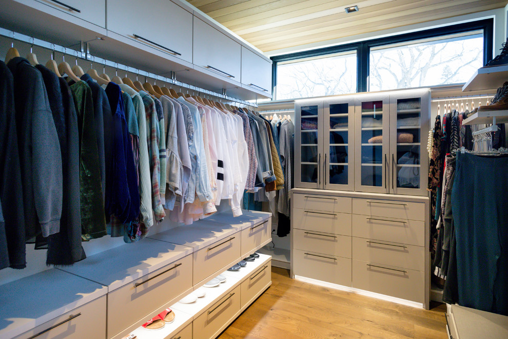 Inspiration for a large modern storage and wardrobe in Minneapolis.