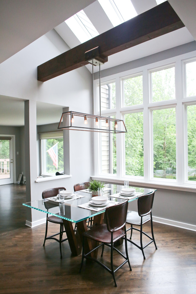 Design ideas for a large modern kitchen/dining combo in Wilmington with dark hardwood floors.