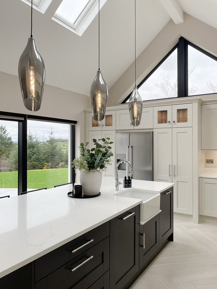 Photo of a classic cream and black kitchen in Other with quartz worktops and a vaulted ceiling.
