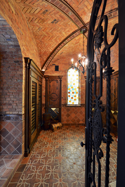This is an example of a large traditional wine cellar in Dallas with storage racks.