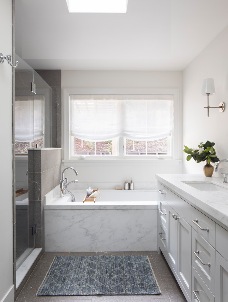 Traditional ensuite bathroom in San Francisco with white cabinets, an alcove bath, an alcove shower, white walls, a hinged door, double sinks, a built in vanity unit and wallpapered walls.