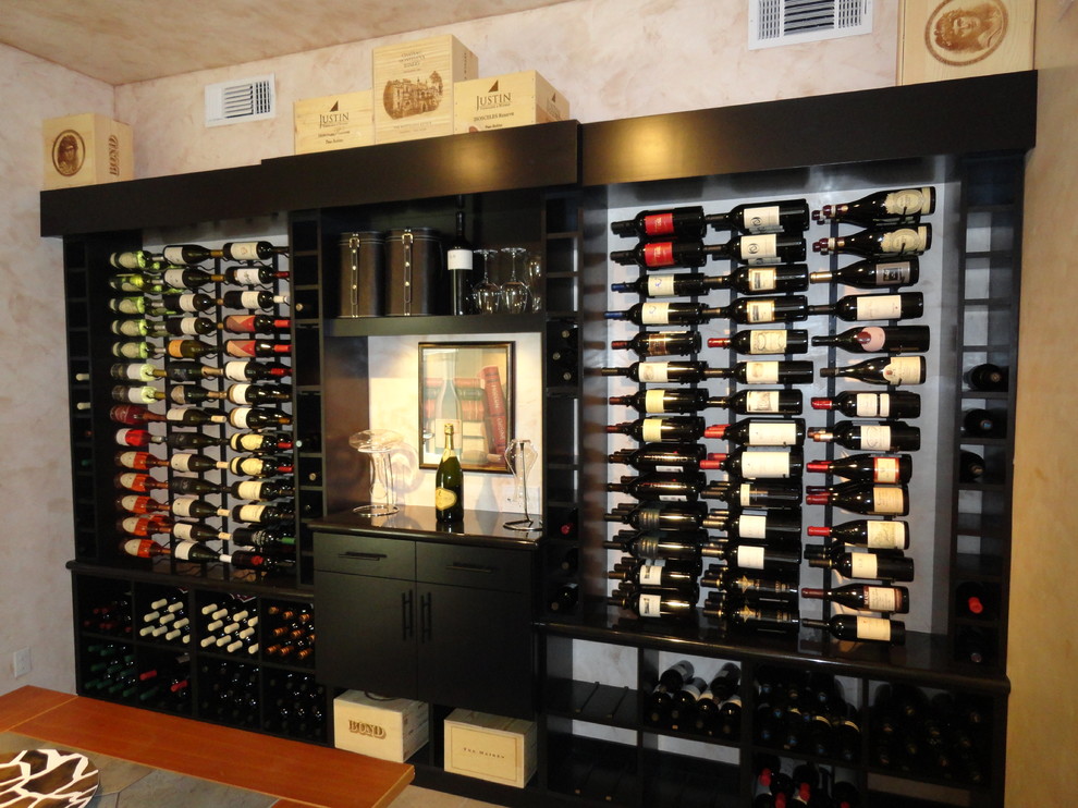 Inspiration for a large modern wine cellar in San Diego with ceramic floors and display racks.