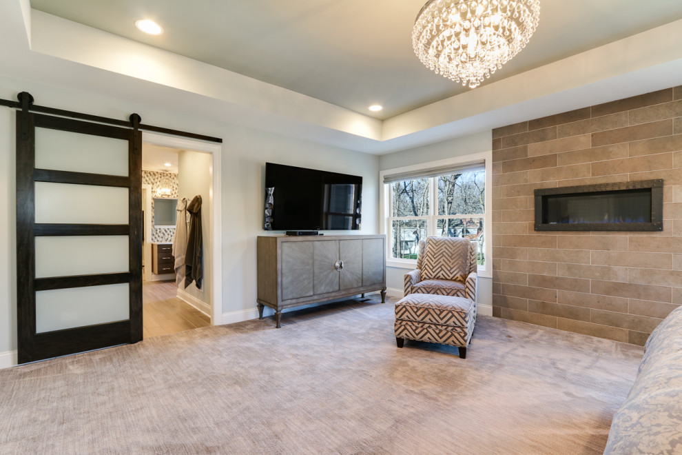 Example of a transitional bedroom design in Chicago