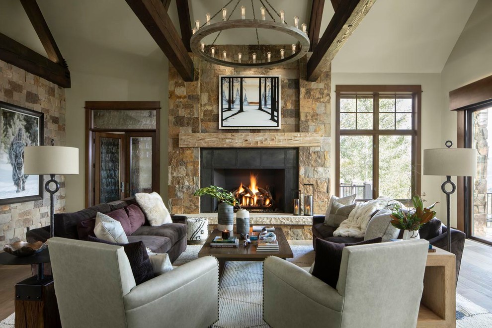 Country living room in Other with white walls, medium hardwood floors, a standard fireplace, a metal fireplace surround and brown floor.