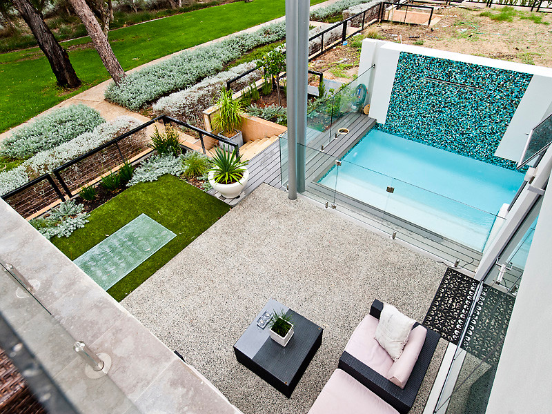 Photo of a large contemporary backyard rectangular lap pool in Perth.
