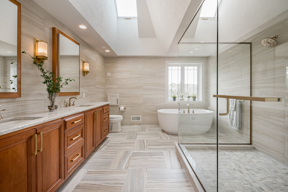 Large contemporary master bathroom in Milwaukee with flat-panel cabinets, medium wood cabinets, a freestanding tub, a corner shower, multi-coloured tile, ceramic tile, ceramic floors, an undermount sink, quartzite benchtops, multi-coloured floor, a hinged shower door, an enclosed toilet, a double vanity, a freestanding vanity and coffered.