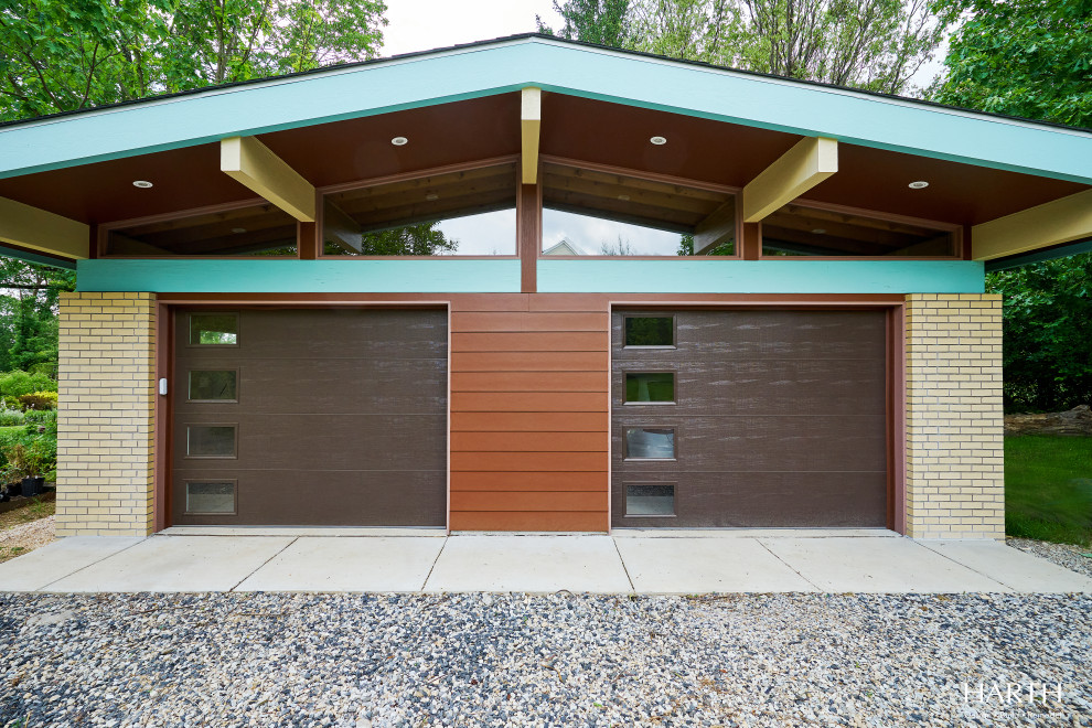 Inspiration for a mid-sized midcentury detached two-car carport in Philadelphia.