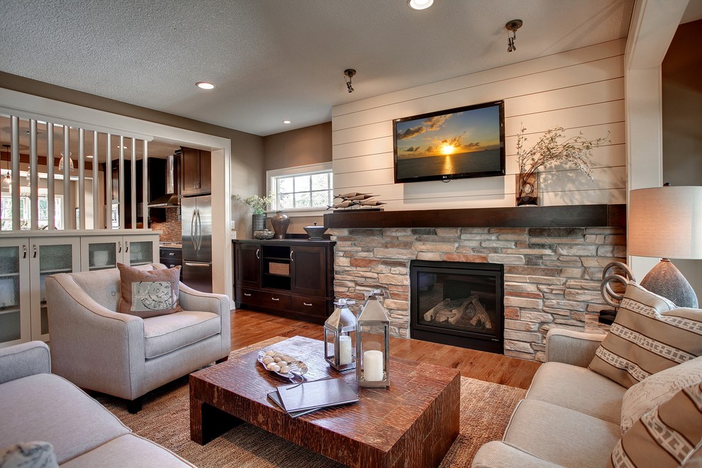 Photo of a country open concept living room in Minneapolis with a standard fireplace.