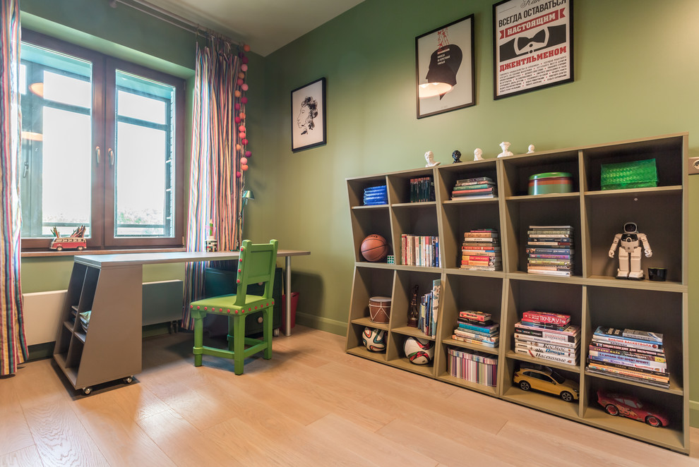 Design ideas for a mid-sized contemporary kids' room for boys in Moscow with green walls and light hardwood floors.