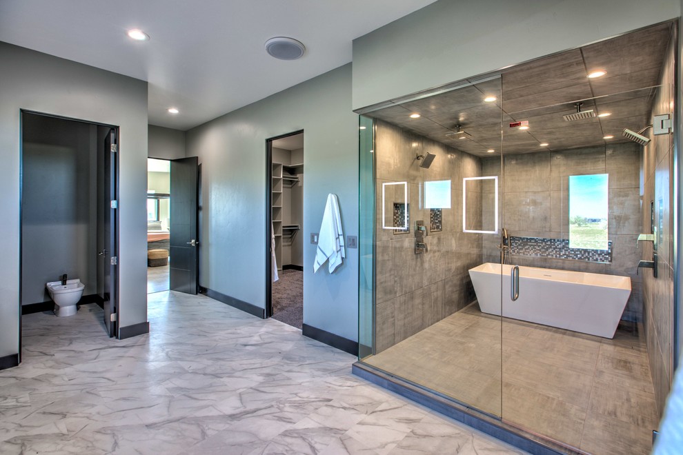 Expansive modern master wet room bathroom in Other with a freestanding tub, green tile, green walls, white floor and a hinged shower door.