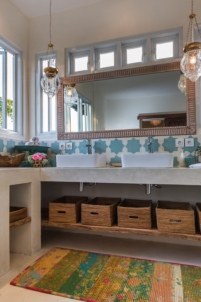 Small eclectic master beige tile and porcelain tile porcelain tile corner shower photo with a vessel sink, open cabinets, concrete countertops, a two-piece toilet and white walls
