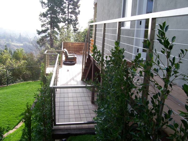 Large transitional metal railing deck photo in Los Angeles