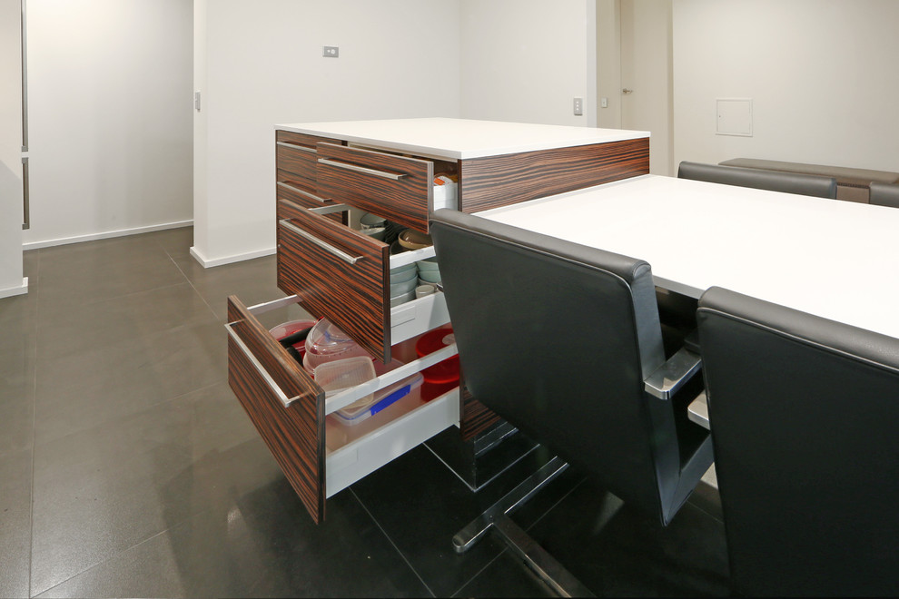 Inspiration for a mid-sized contemporary galley eat-in kitchen in Melbourne with an undermount sink, flat-panel cabinets, white cabinets, quartz benchtops, metallic splashback, mirror splashback, stainless steel appliances, porcelain floors and with island.