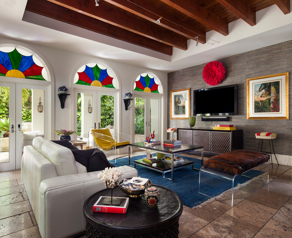 Design ideas for an eclectic open concept family room in Miami with a wall-mounted tv.