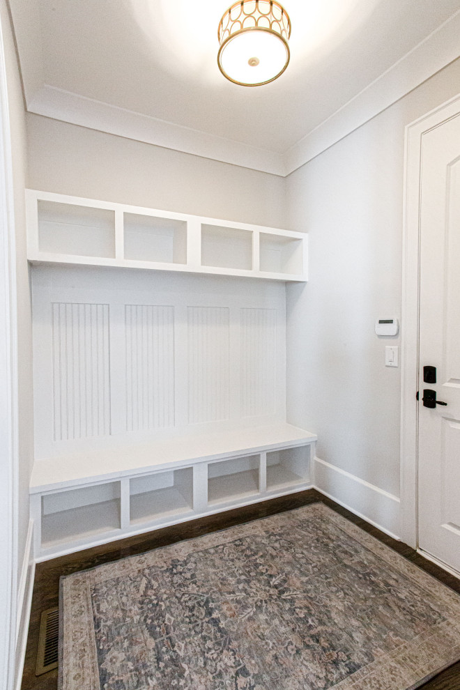 Inspiration for a large transitional mudroom in Atlanta with grey walls, medium hardwood floors, a double front door, a dark wood front door, brown floor and coffered.