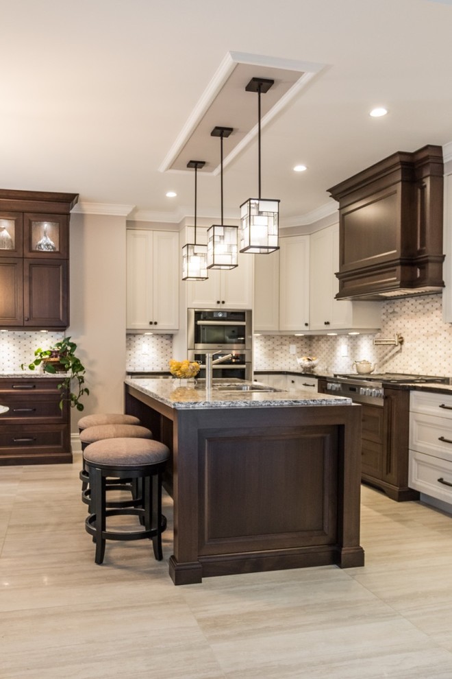 Mid-sized transitional l-shaped ceramic tile eat-in kitchen photo in Toronto with shaker cabinets, granite countertops, mosaic tile backsplash, stainless steel appliances, an island, gray backsplash, a double-bowl sink and white cabinets