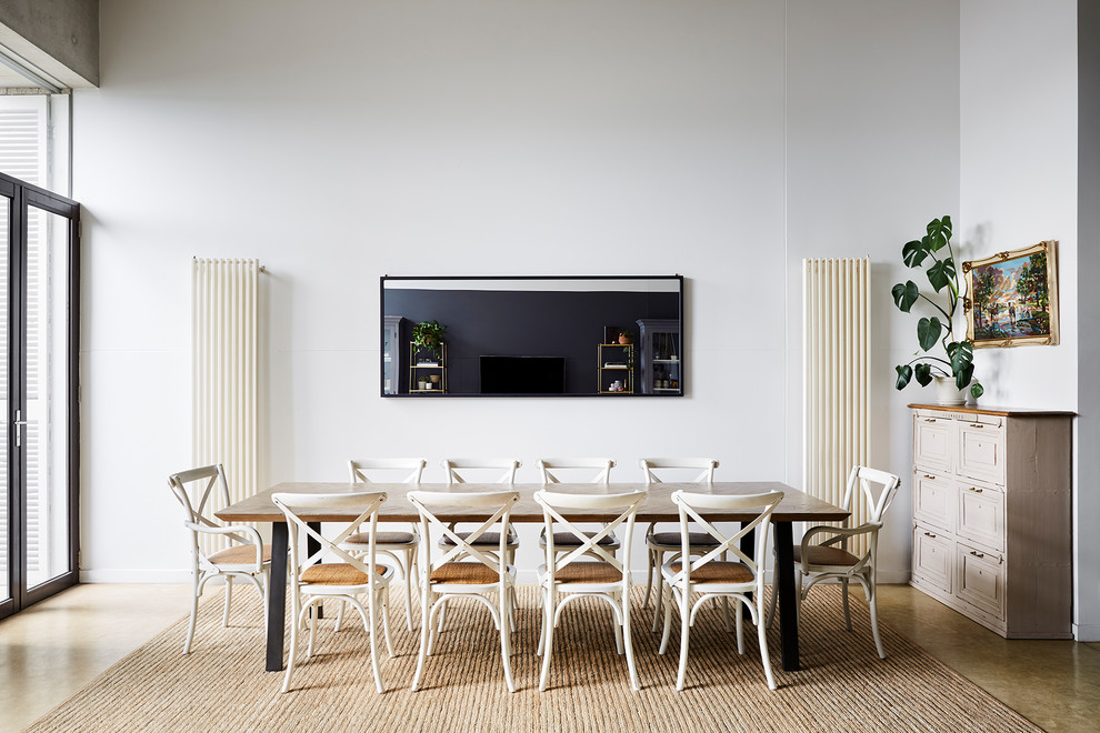 Photo of a contemporary open plan dining in Melbourne with white walls, no fireplace and beige floor.